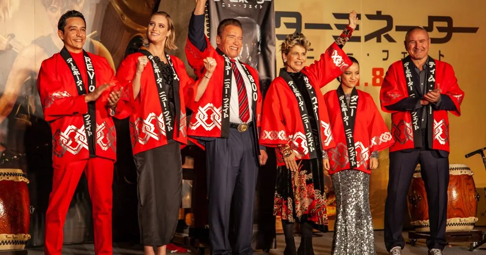 Arnold Schwarzenegger plays taiko drums with Terminator: Dark Fate cast at Tokyo premiere