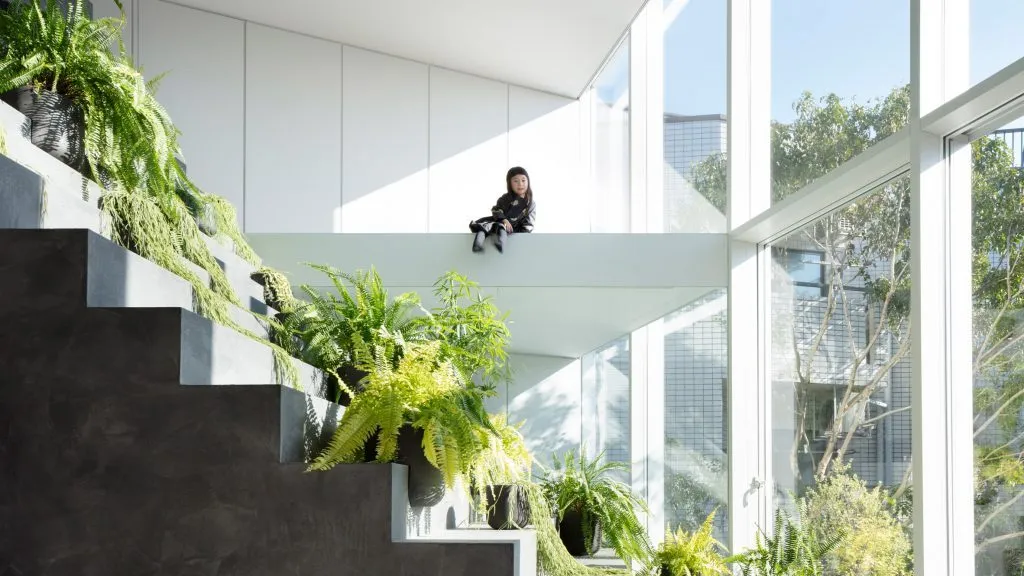 Steel and concrete steps cut through facade of Stairway House by Nendo