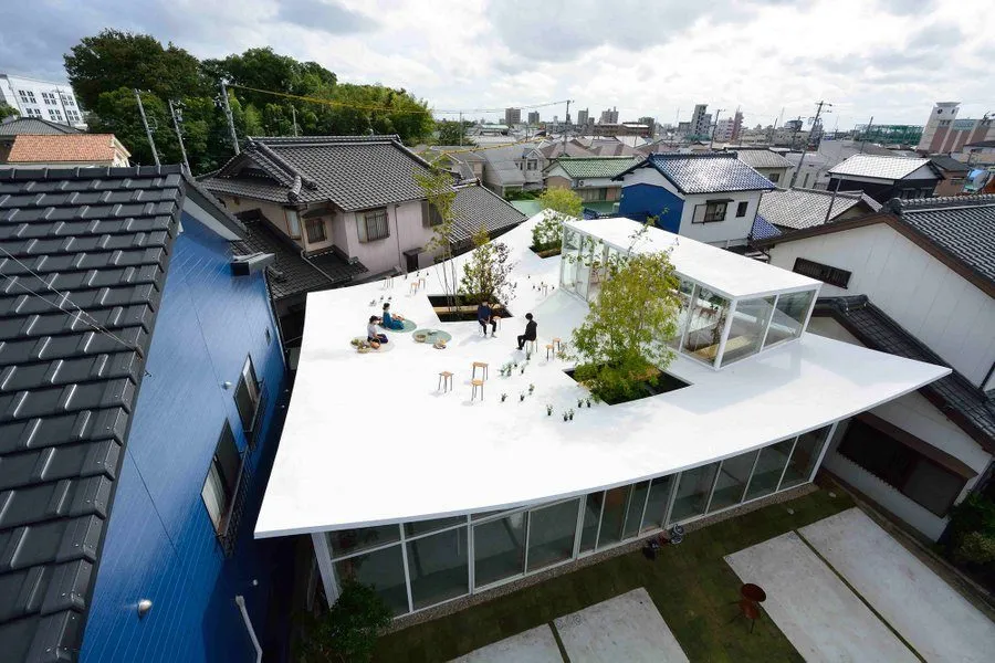 An Architecture Firm Designed Their Own Office With A Sloping, Inhabitable Roof