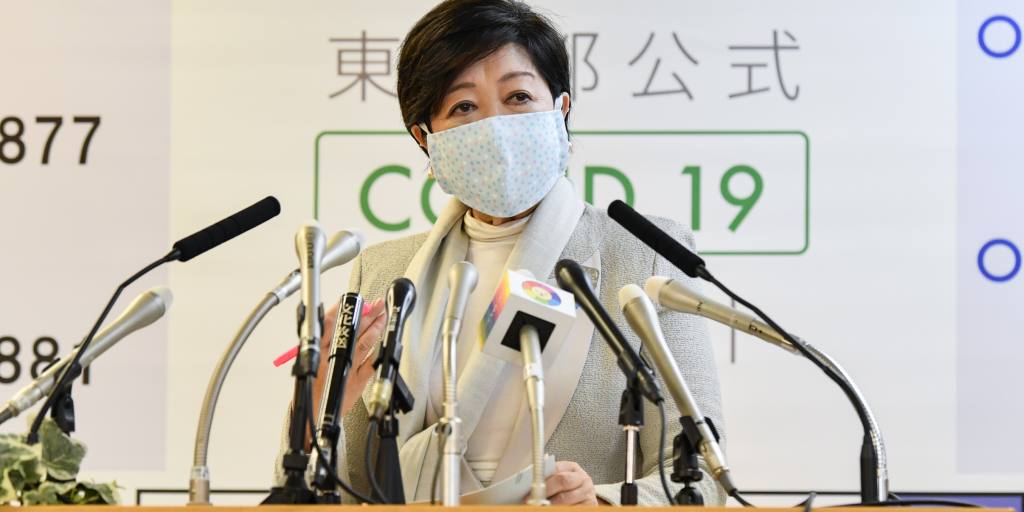 Tokyo unveils toothless coronavirus rules as cases hit record high
